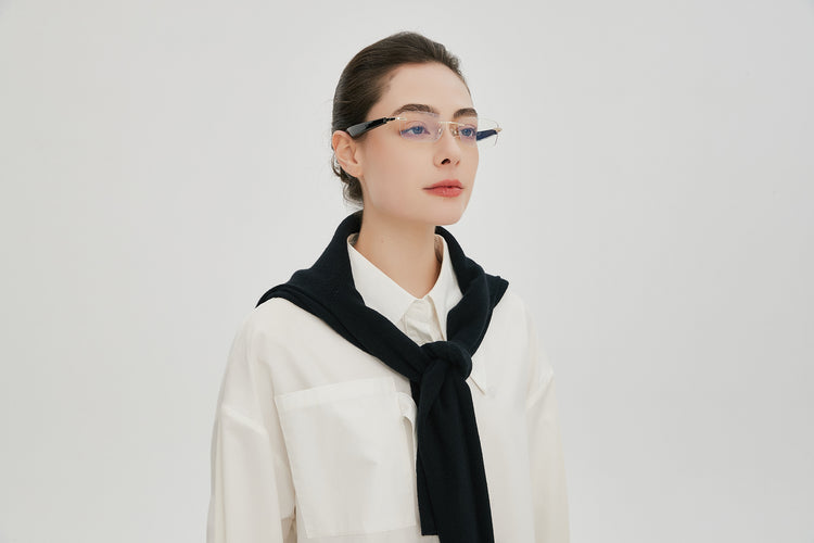 Sidequest Pro Beck rimless smart glasses worn by a model